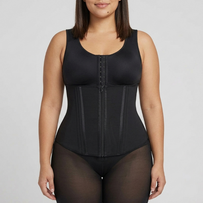 Woman wearing a black waist trainer against a plain background
